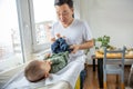 Father changing diapers to his newborn son Royalty Free Stock Photo