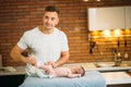 Father is changing nappy to his baby boy Royalty Free Stock Photo