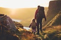 Father and child with backpacks admiring scenic view of spectacular Irish nature. Breathtaking landscape of Ireland. Hiking by