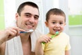 Father and child boy brushing teeth going to bed Royalty Free Stock Photo