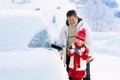 Father and child brushing off car in winter Royalty Free Stock Photo