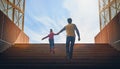 Father and child climb upstairs. Royalty Free Stock Photo