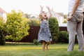 father and child daughter playing with soap bubbles outdoors on summer holiday vacation. Hands up. happy childhood Royalty Free Stock Photo