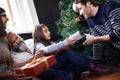 Father, child and gift by Christmas tree in home, festive season and present for bonding on xmas. Happy family, girl and Royalty Free Stock Photo