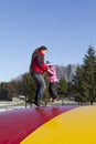 Father and child jumping on trampoline Royalty Free Stock Photo