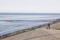 Father and child are looking over dutch Waddenzee Royalty Free Stock Photo