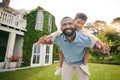 Father, child and piggyback outdoor or garden for real estate happiness, celebration and game at new house. Dream home Royalty Free Stock Photo