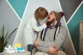 Father and child playing clinic and doctor, little boy dentist in medical gown with stethoscope treats dad Royalty Free Stock Photo