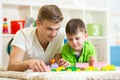 Father and child playing construction game Royalty Free Stock Photo