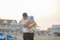 Father and child playing on tropical beach at sunset. Family summer vacation at sea resort. Dad playing with kids on sunny evening Royalty Free Stock Photo