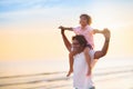 Father and child playing on tropical beach Royalty Free Stock Photo