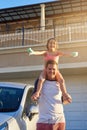 Father, child and shoulders in yard for portrait, happy and soap with sponge for washing family car. Dad, girl and Royalty Free Stock Photo