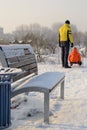 Father and child sledding in the Park.
