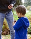 Father and child son in autumn park Royalty Free Stock Photo