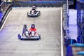 Father and child, son, having fun at gokart carting car race