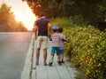 Father with children on evening walk