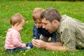 Father and children in garden Royalty Free Stock Photo