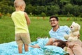 Father With Children Having Fun In Park. Happy Family In Nature Royalty Free Stock Photo