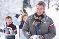 Father And Children Having Snowball Fight Royalty Free Stock Photo