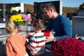 Father and children lighting a candle at the grave Royalty Free Stock Photo