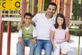 Father with children in playground Royalty Free Stock Photo