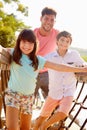 Father With Children On Playground Climbing Frame Royalty Free Stock Photo