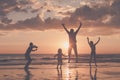 Father and children playing on the beach at the sunset time. Royalty Free Stock Photo