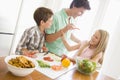 Father And Children Prepare A meal