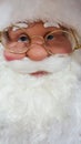 Father Christmas mannequin wearing gold rimmed spectacles Royalty Free Stock Photo