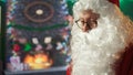 Father Christmas navigating the web checking on children wish lists Royalty Free Stock Photo