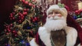 Father Christmas / Santa Claus mannequin with decorations and christmas tree in background Royalty Free Stock Photo