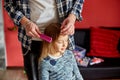 Father combing, brushing his daughter's hair at home Royalty Free Stock Photo