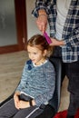 Father combing, brushing his daughter& x27;s hair at home Royalty Free Stock Photo