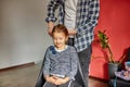 Father combing, brushing his daughter's hair at home Royalty Free Stock Photo