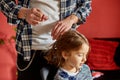 Father combing, brushing his daughter& x27;s hair at home Royalty Free Stock Photo