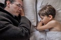 Father come to say goodbye to child boy before leave for work in morning, on bed