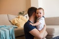 Father comforting crying baby Royalty Free Stock Photo