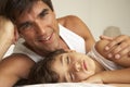 Father Comforting Sleeping Son In Bed Royalty Free Stock Photo