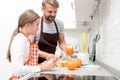 Father Cooking with Teenage Girl