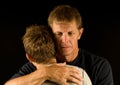 Father, crying, hugs son Royalty Free Stock Photo