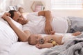 Father with his cute baby sleeping in bed at home Royalty Free Stock Photo