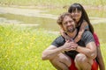 Father and daughter on a beautiful green meadow. Royalty Free Stock Photo