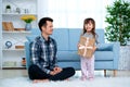 Father and daughter or brother and sister with a gift in the interior of the room. Father`s day holiday concept, Children`s Day Royalty Free Stock Photo