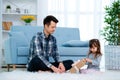 Father and daughter or brother and sister with a gift in the interior of the room. Father`s day holiday concept, Children`s Day Royalty Free Stock Photo