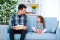 Father and daughter or brother and sister with a gift in the interior of the room. Father`s day holiday concept, Children`s Day Royalty Free Stock Photo