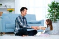 Father and daughter or brother and sister with a gift in the interior of the room. Father`s day holiday concept, Children`s Day Royalty Free Stock Photo