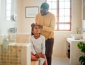 Father, daughter and brushing hair in a home bathroom with love, trust and support. Man teaching child self care, health Royalty Free Stock Photo