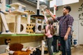 Father and daughter buying supplies in petshop