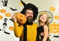 Father and daughter in costumes. Girl and bearded man