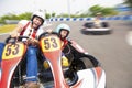 Father and daughter driving go kart on the track Royalty Free Stock Photo